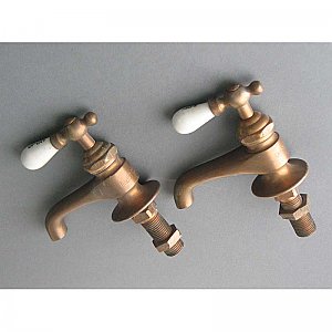 Pair of separate hot and cold taps in unfinished bronze