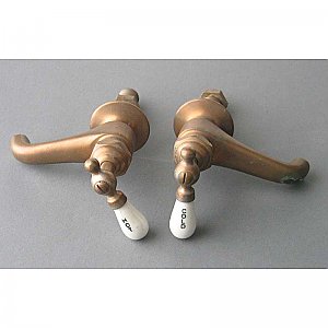 Pair of separate hot and cold taps in unfinished bronze